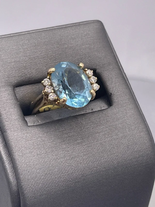 Ladies 14 Karat Yellow Gold Oval Blue Topaz Diamond Ring