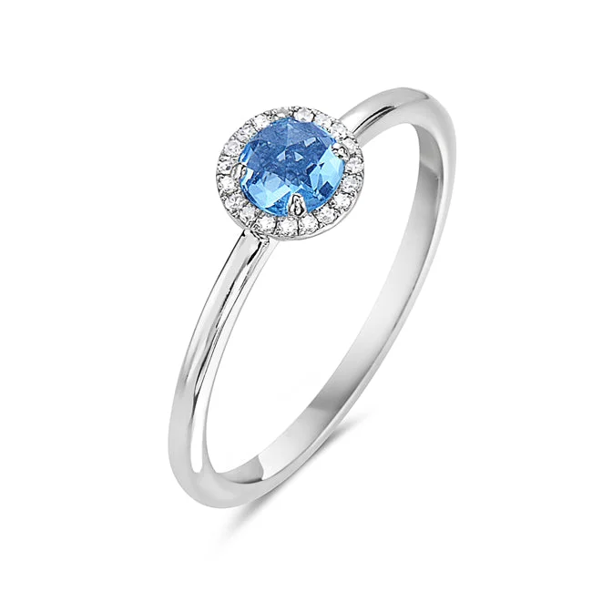 women’s gemstone engagement rings-Blue Topaz And Diamond Halo Ring