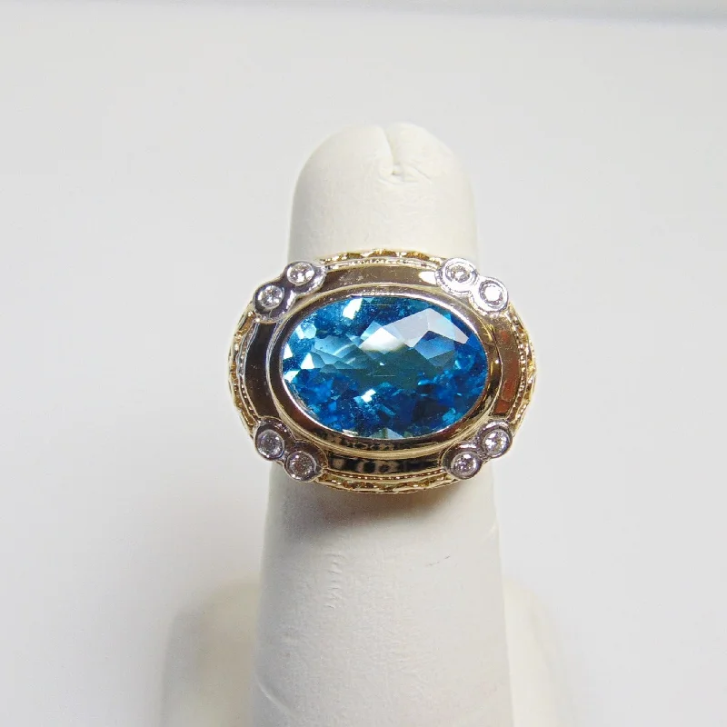 14 Karat Yellow Gold Blue Topaz And Diamond Ring